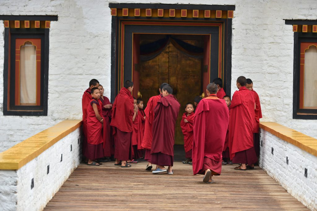 a group of people in red robes