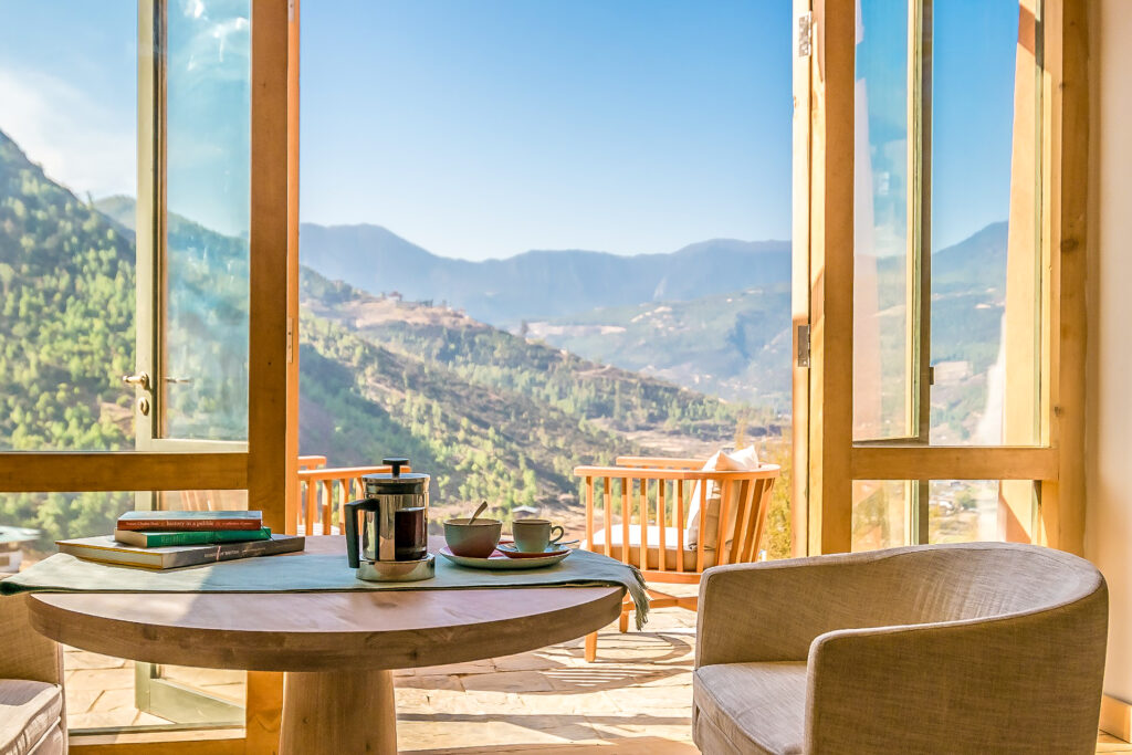 a table with a view of mountains and a view of the valley