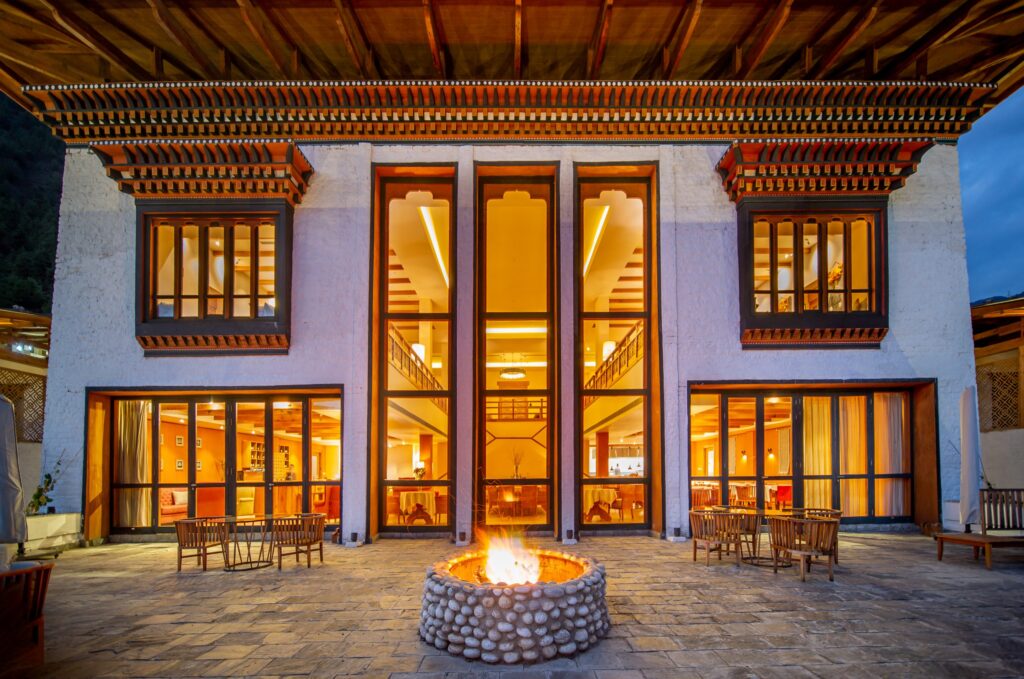 a fire pit in front of a building bhutan spirit sanctuary